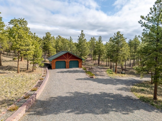 view of road featuring curbs and aphalt driveway