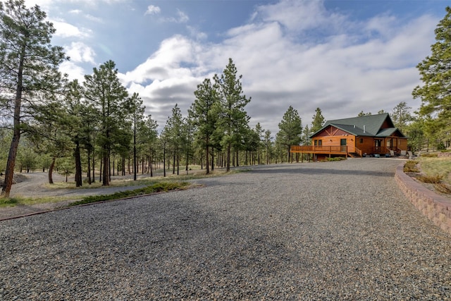 view of road with gravel driveway