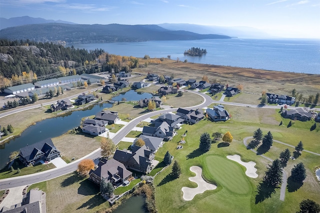1347 Lake Pointe Dr, Bigfork, MT 59911 - aerial overview of property's location with a water and mountain view, nearby suburban area, and a golf course