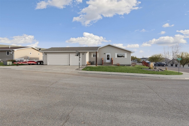 3404 Jasper Rd, Great Falls, MT 59404 - single story home with a garage, concrete driveway, and a front lawn