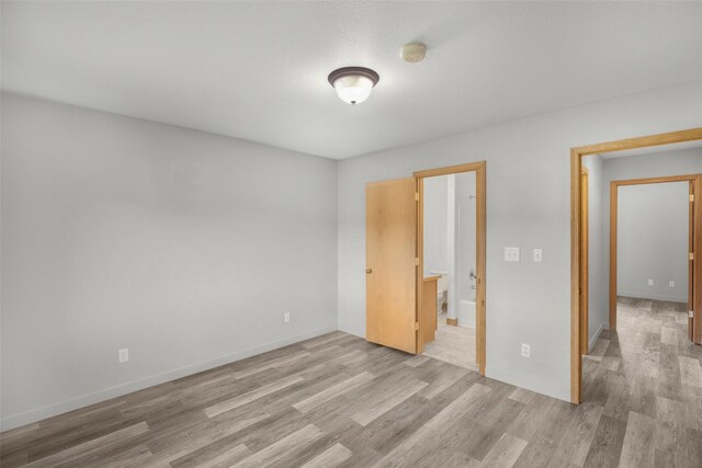 3404 Jasper Rd, Great Falls, MT 59404 - unfurnished bedroom featuring light wood-type flooring and baseboards