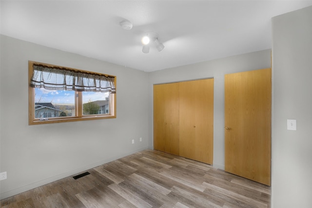 3404 Jasper Rd, Great Falls, MT 59404 - unfurnished bedroom with wood finished floors and a closet