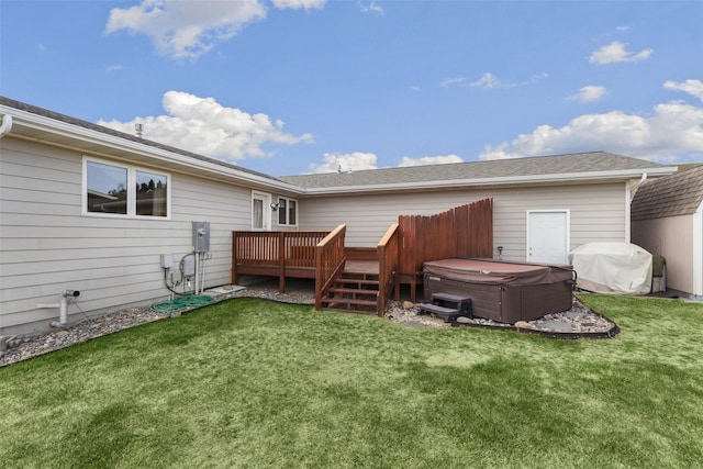 3404 Jasper Rd, Great Falls, MT 59404 - back of house featuring a hot tub, a wooden deck, a lawn, and a shingled roof