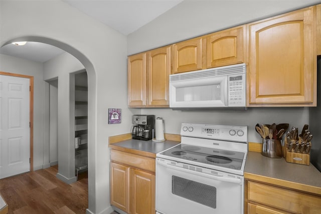 3404 Jasper Rd, Great Falls, MT 59404 - kitchen featuring white appliances, dark wood-style flooring, arched walkways, and light brown cabinetry