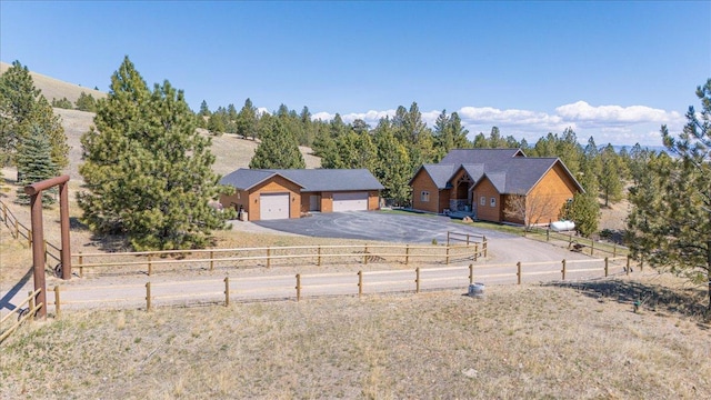 160 Jackson Creek Rd, Clancy, MT 59634 - view of yard featuring a detached garage and asphalt driveway