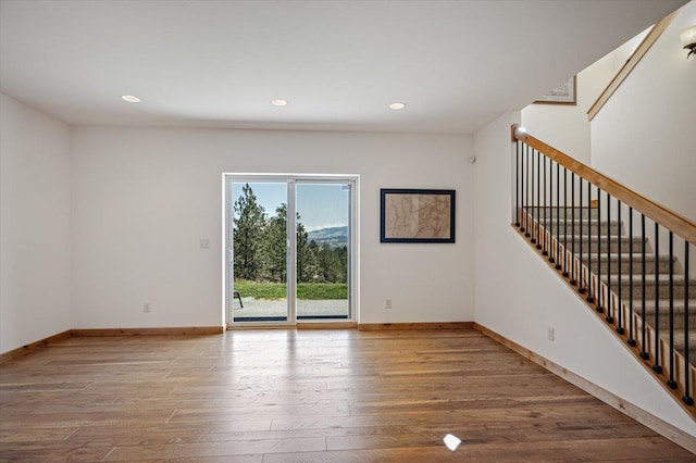 160 Jackson Creek Rd, Clancy, MT 59634 - unfurnished living room with wood finished floors, stairs, and recessed lighting