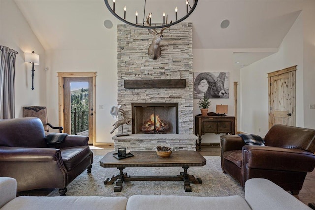 160 Jackson Creek Rd, Clancy, MT 59634 - living room with lofted ceiling, wood finished floors, and a fireplace