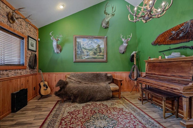 160 Jackson Creek Rd, Clancy, MT 59634 - sitting room featuring wood finished floors, a wainscoted wall, a chandelier, lofted ceiling, and wood walls