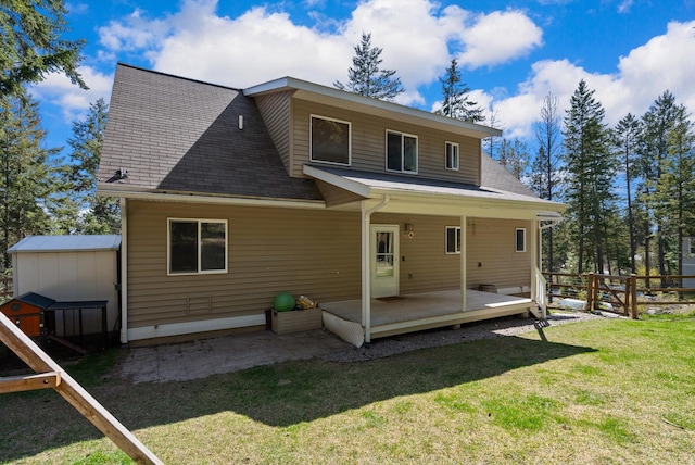 116 Grandview Ter, Lakeside, MT 59922 - rear view of house featuring a shingled roof and a deck