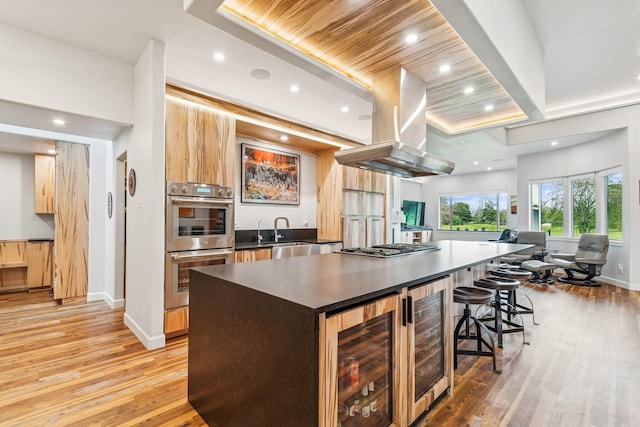 14 Buffalo Hill Cir, Kalispell, MT 59901 - kitchen featuring wine cooler, a sink, stainless steel appliances, a large island, and recessed lighting