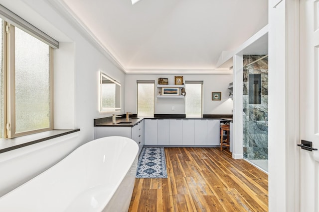 14 Buffalo Hill Cir, Kalispell, MT 59901 - full bathroom with a stall shower, hardwood / wood-style floors, double vanity, and a soaking tub