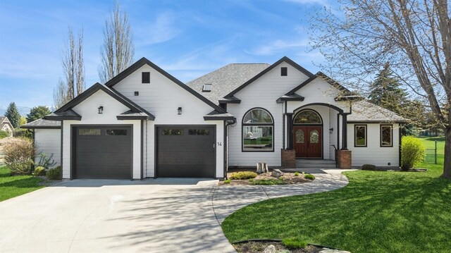 14 Buffalo Hill Cir, Kalispell, MT 59901 - french country home with a front yard, driveway, and a garage