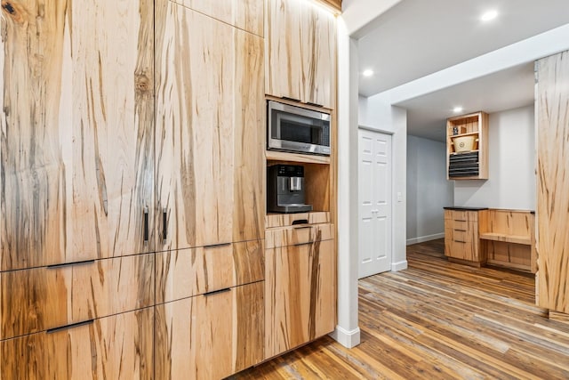 14 Buffalo Hill Cir, Kalispell, MT 59901 - kitchen with stainless steel microwave, light wood-style flooring, baseboards, recessed lighting, and open shelves