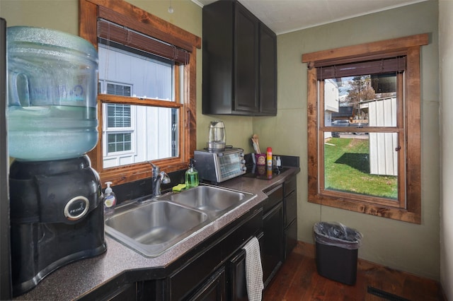 916 2nd St E, Whitefish, MT 59937 - kitchen with dark cabinetry and dark wood-style flooring