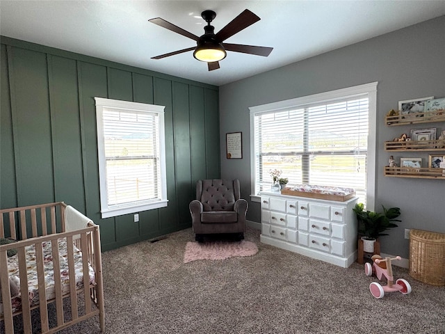 19 Country Meadow Ln, Clancy, MT 59634 - bedroom featuring a nursery area, multiple windows, carpet floors, and ceiling fan