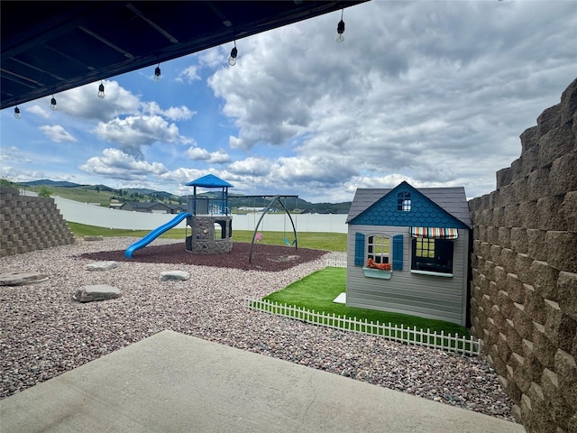 19 Country Meadow Ln, Clancy, MT 59634 - view of play area with a patio