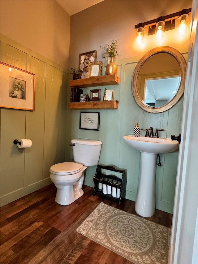 19 Country Meadow Ln, Clancy, MT 59634 - half bathroom featuring wood finished floors and a decorative wall