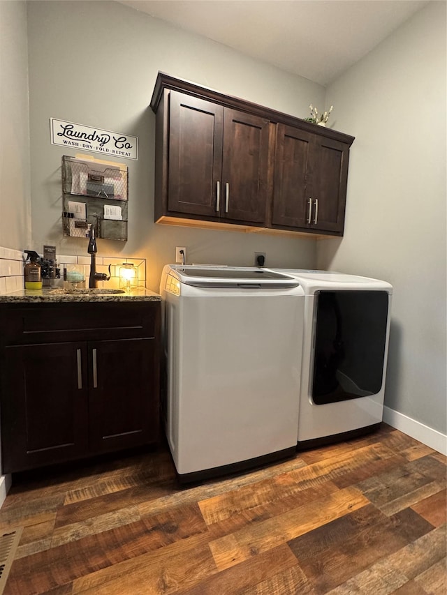 19 Country Meadow Ln, Clancy, MT 59634 - washroom with cabinet space, washing machine and clothes dryer, and dark wood-style floors