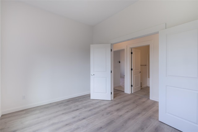 209 Pearl St, Ennis, MT 59729 - unfurnished bedroom featuring light wood-style floors and baseboards