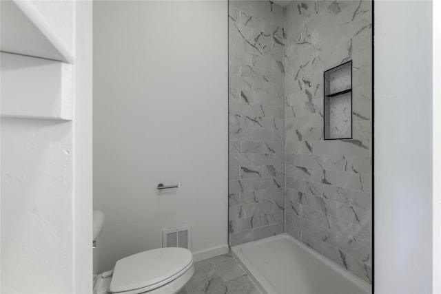 209 Pearl St, Ennis, MT 59729 - bathroom featuring toilet, marble look tile flooring, baseboards, and a stall shower
