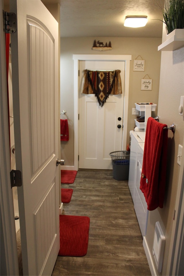 mudroom featuring dark wood-style floors