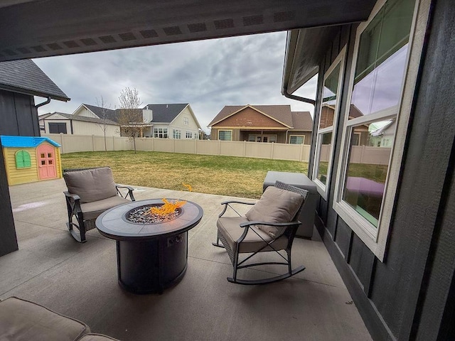 123 Owl Loop, Kalispell, MT 59901 - view of patio / terrace featuring a fire pit and a fenced backyard