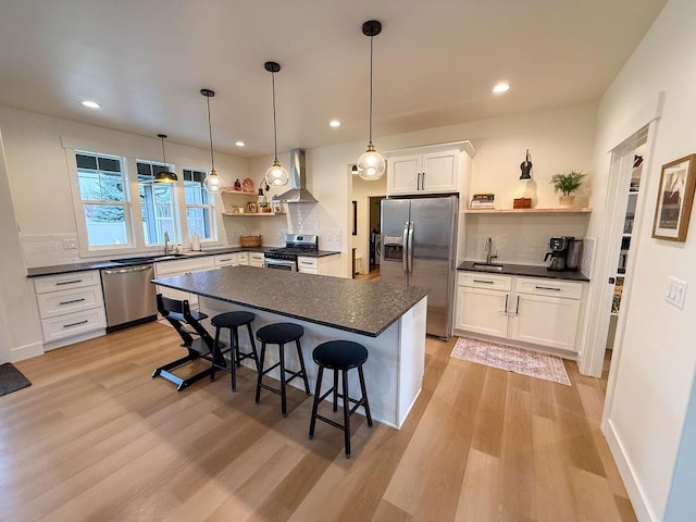 123 Owl Loop, Kalispell, MT 59901 - kitchen featuring a sink, stainless steel appliances, open shelves, wall chimney exhaust hood, and dark countertops