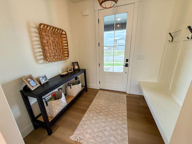 123 Owl Loop, Kalispell, MT 59901 - doorway to outside featuring wood finished floors and baseboards