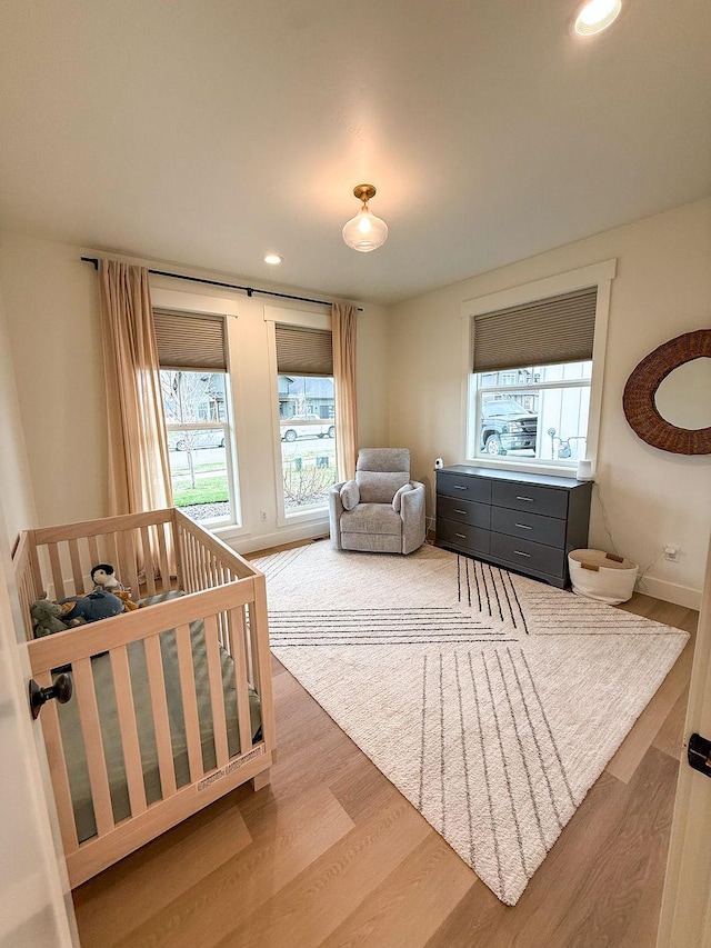 123 Owl Loop, Kalispell, MT 59901 - bedroom featuring baseboards, recessed lighting, and wood finished floors
