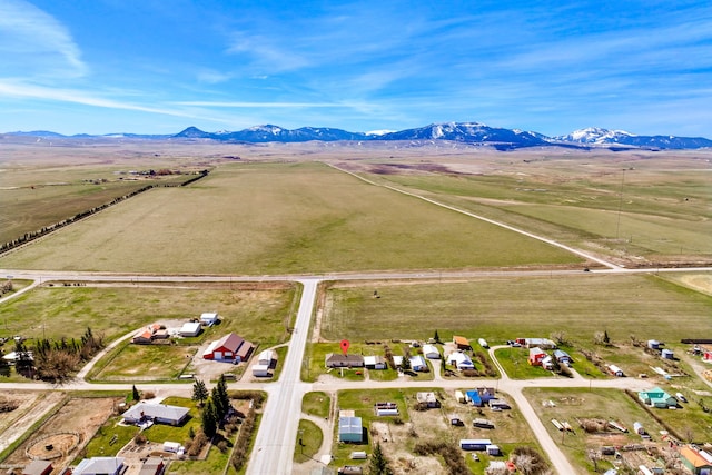 drone / aerial view with a mountain view and a rural view
