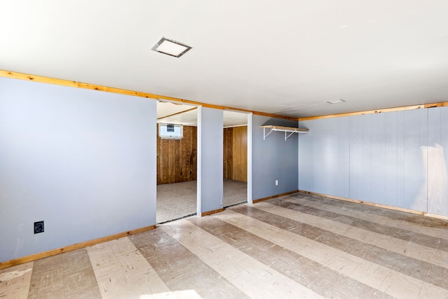 interior space with baseboards and wood finished floors
