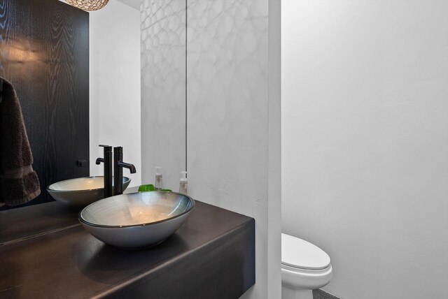 bathroom featuring toilet and a sink