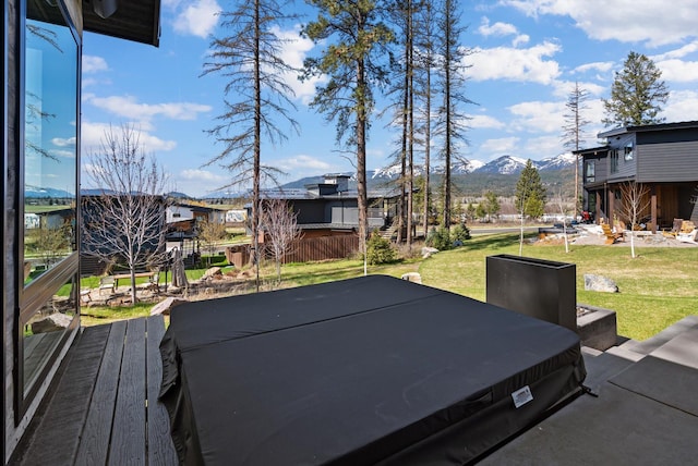 exterior space with a mountain view and fence