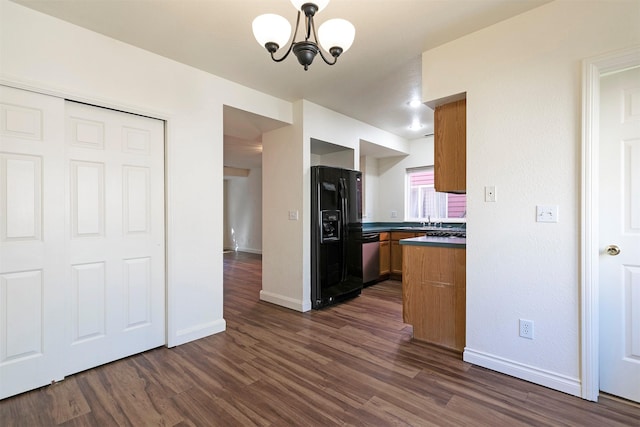 1312 Bridgecourt Way, Missoula, MT 59801 - kitchen featuring black refrigerator with ice dispenser, a chandelier, dark wood-style flooring, dark countertops, and baseboards