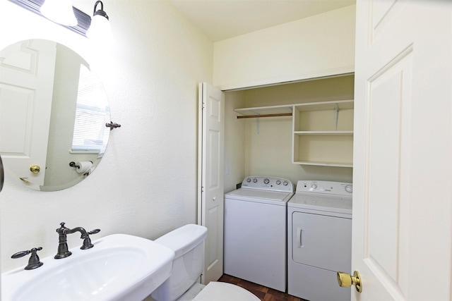 1312 Bridgecourt Way, Missoula, MT 59801 - half bathroom featuring a sink, washing machine and clothes dryer, and toilet