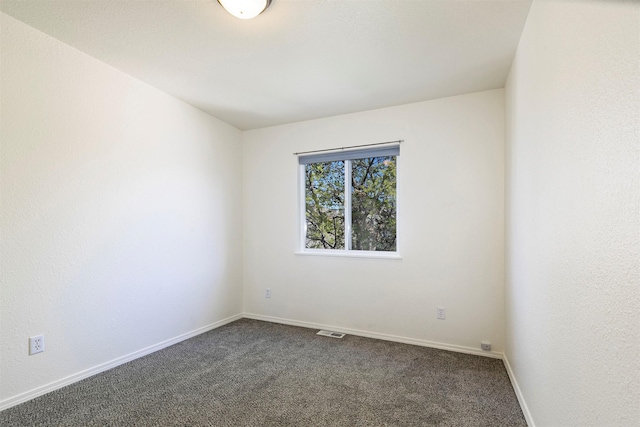 1312 Bridgecourt Way, Missoula, MT 59801 - spare room featuring dark carpet and baseboards