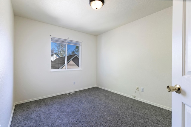 1312 Bridgecourt Way, Missoula, MT 59801 - spare room featuring dark carpet and baseboards