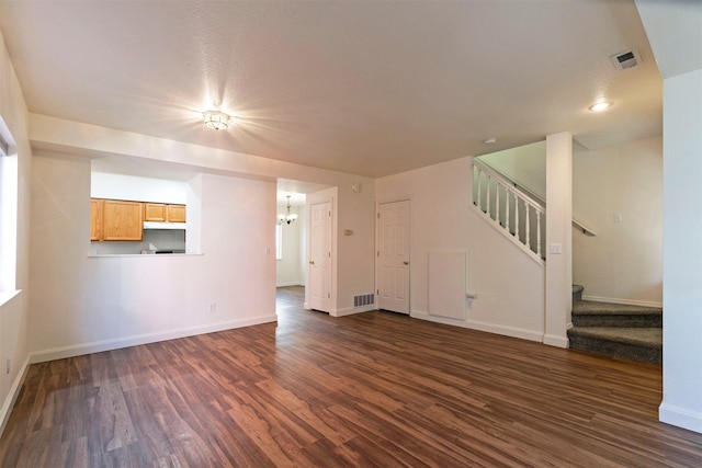 1312 Bridgecourt Way, Missoula, MT 59801 - unfurnished living room with dark wood-style floors, stairway, and baseboards