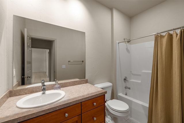 full bath featuring toilet, shower / bath combo with shower curtain, and vanity