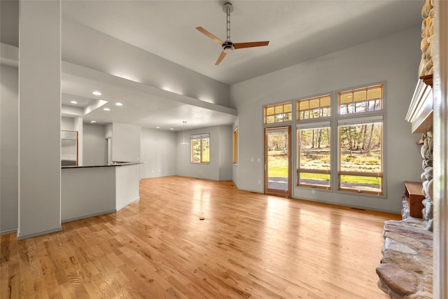 unfurnished living room with light wood finished floors, recessed lighting, and ceiling fan