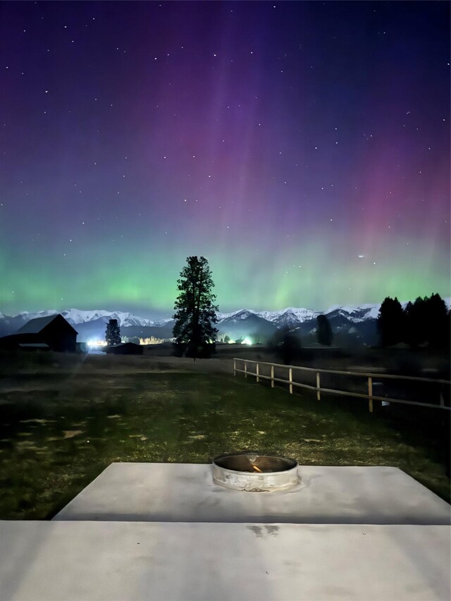 21 Bear Paw Loop, Bigfork, MT 59911 - view of yard with an outdoor fire pit and a patio area