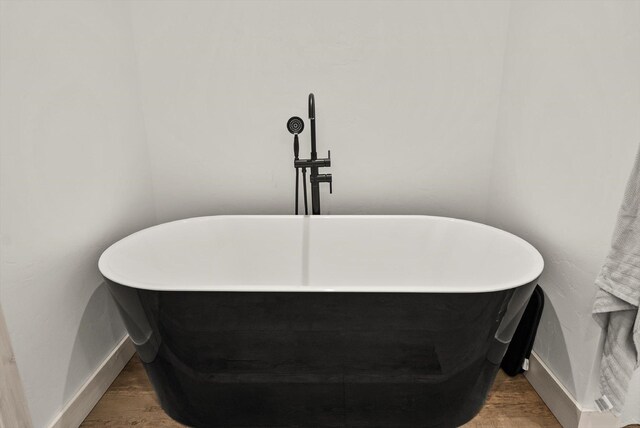 21 Bear Paw Loop, Bigfork, MT 59911 - bathroom view of a freestanding tub and wood finished floors