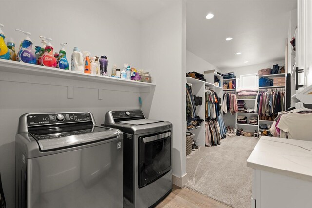 21 Bear Paw Loop, Bigfork, MT 59911 - laundry area with washing machine and clothes dryer, light wood-type flooring, and recessed lighting