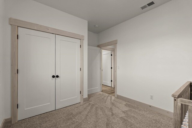 21 Bear Paw Loop, Bigfork, MT 59911 - unfurnished bedroom with carpet floors and a closet
