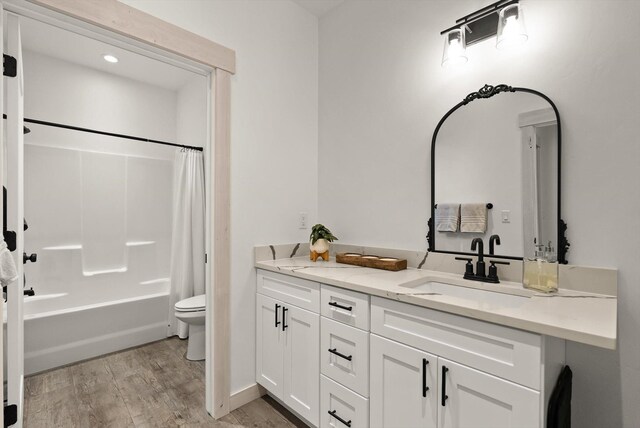 21 Bear Paw Loop, Bigfork, MT 59911 - bathroom featuring vanity, wood finished floors, and shower / tub combo