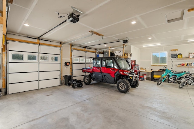21 Bear Paw Loop, Bigfork, MT 59911 - garage featuring a garage door opener and recessed lighting