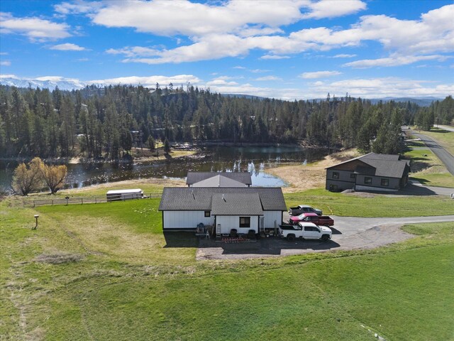 21 Bear Paw Loop, Bigfork, MT 59911 - aerial view of property and surrounding area with a heavily wooded area and a large body of water