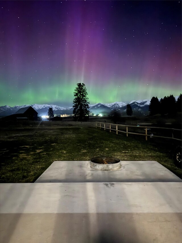 21 Bear Paw Loop, Bigfork, MT 59911 - view of yard with a patio and an outdoor fire pit