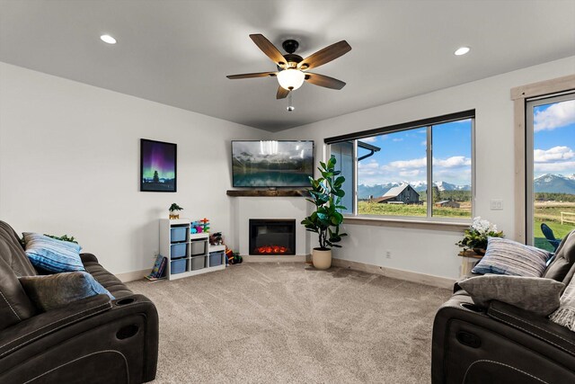 21 Bear Paw Loop, Bigfork, MT 59911 - living area with a ceiling fan, carpet, a glass covered fireplace, healthy amount of natural light, and recessed lighting