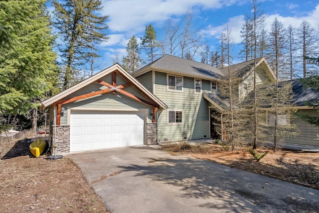 view of front facade with driveway, an attached garage, and stone siding